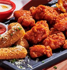 TGI Fridays: 6 Free Boneless Wings w/ purchase until April 8